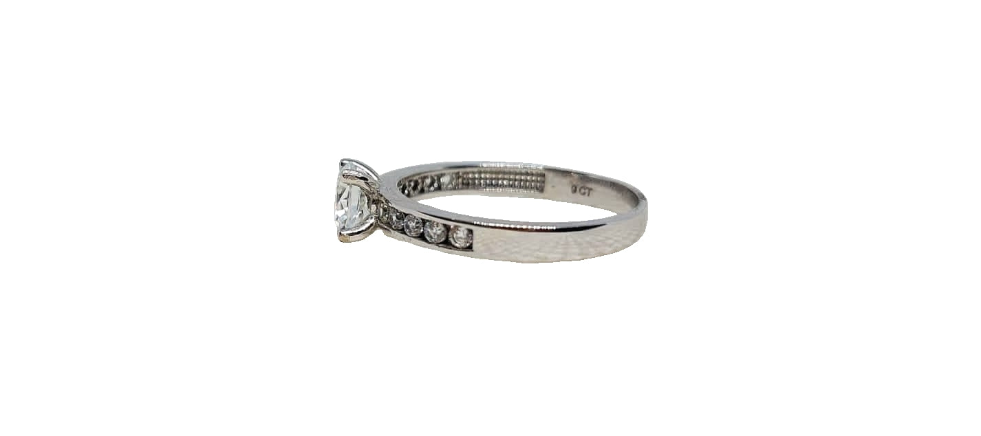 9ct White gold cubic zirconia 4 claw with cubic zirconia channel setting on shank ring
