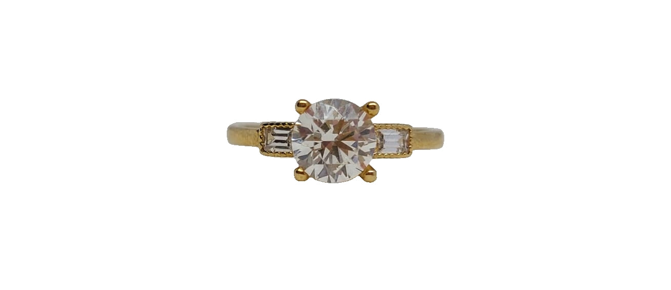 9ct Yellow gold round 4 claw cubic zirconia baguette-cut on shank ring