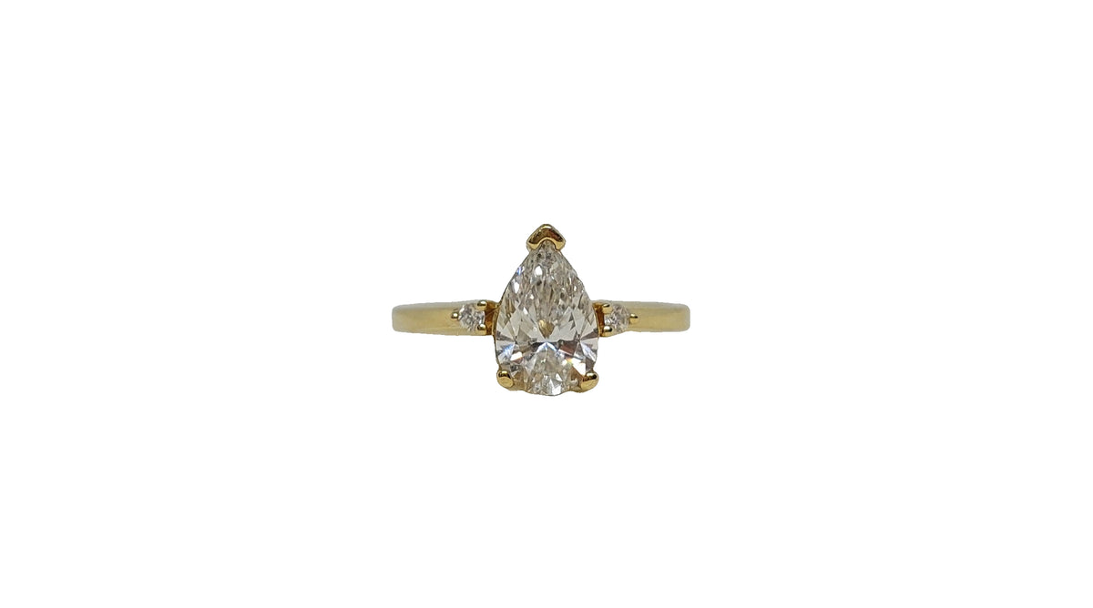 9ct Yellow gold pear shape lab diamond with 2 round shape lab diamond on shank ring