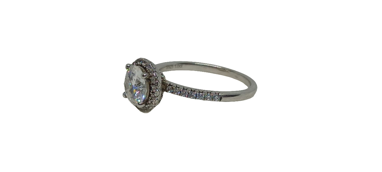 Sterling silver 18ct rhodium plated with a raised gallery moissanite and cubic zirconia halo and cubic zirconia shank ring