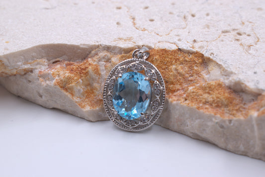 Sterling Silver Oval Blue Topaz With a fancy Halo (November Birthstone)
