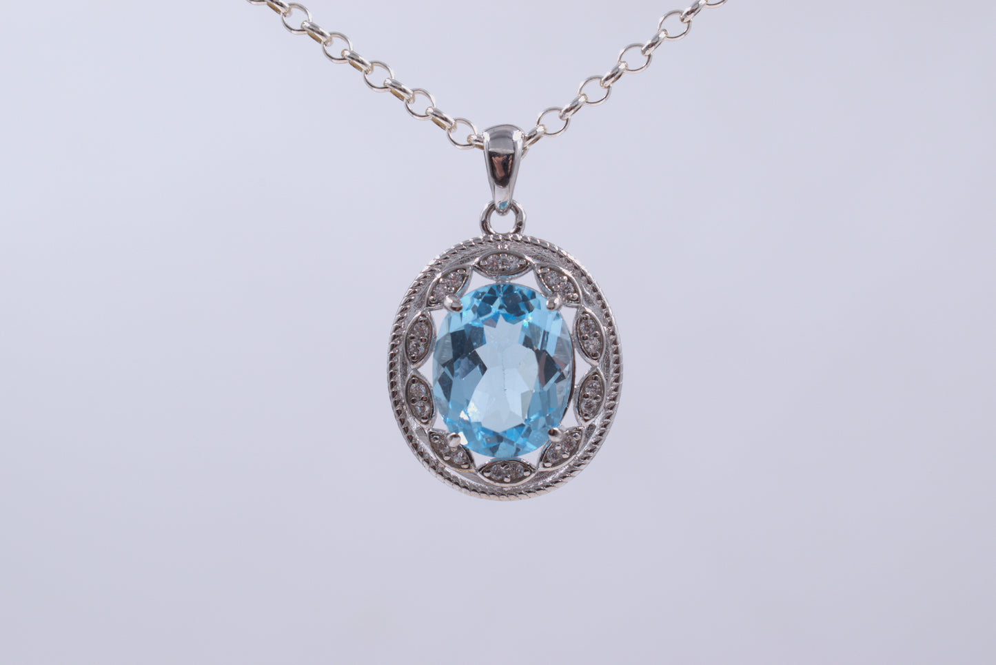 Sterling Silver Oval Blue Topaz With a fancy Halo (November Birthstone)