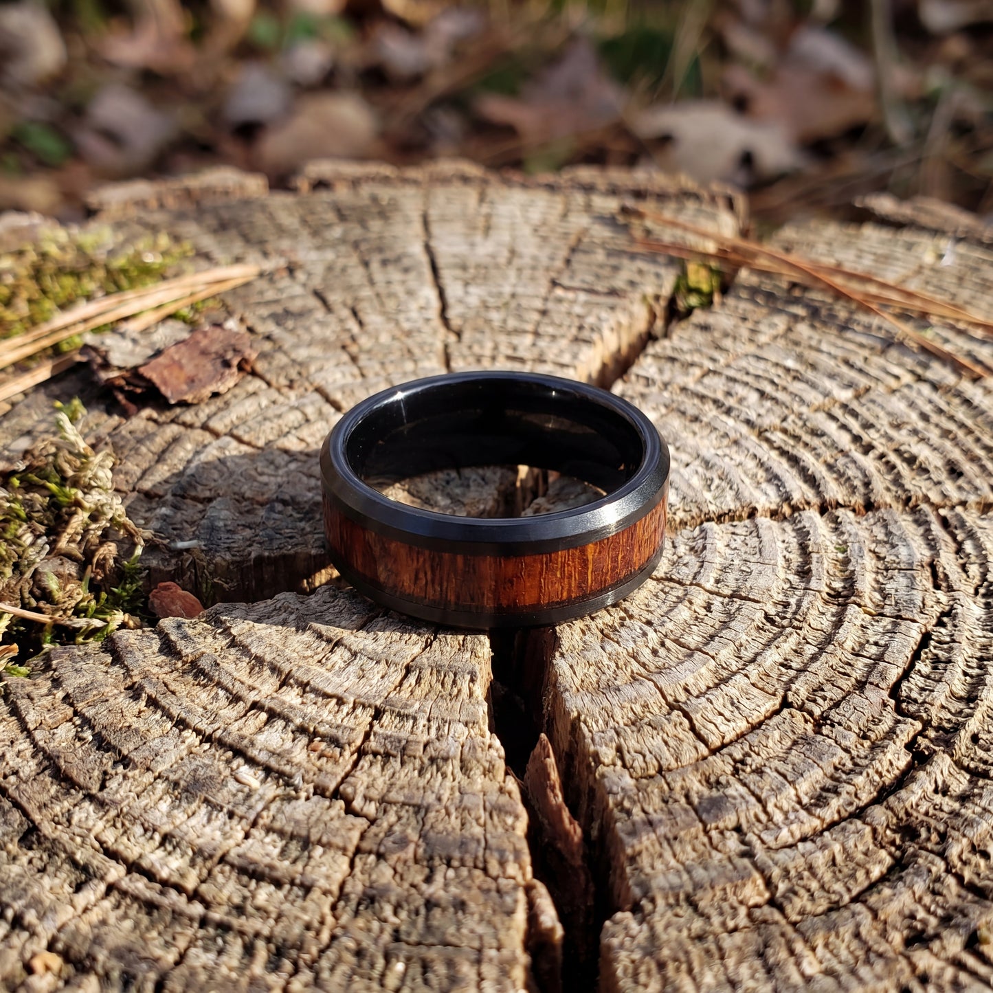 Black tungsten ring with cherry wood inlay